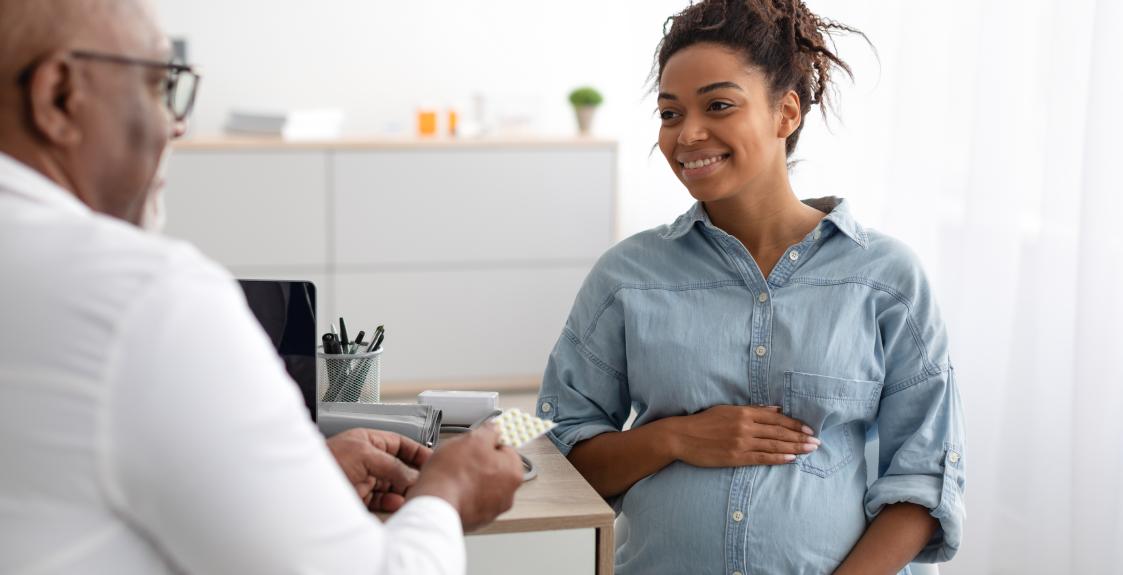 A doctor and a pregnant patient discuss using low-dose aspirin during pregnancy.